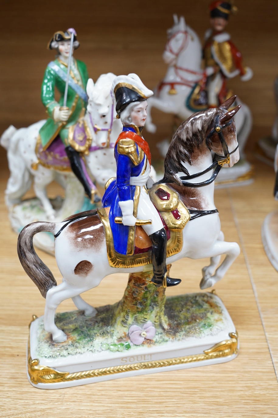 A group of eight Italian porcelain figures on horseback, tallest 30cm. Condition - fair